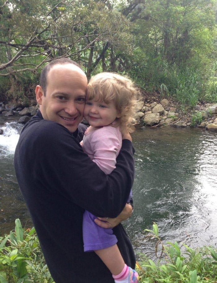 Daddy and baby enjoying time by the river in the Costa Rica rainforest. We have NEVER regretted taking our girls on vacation to Costa Rica!