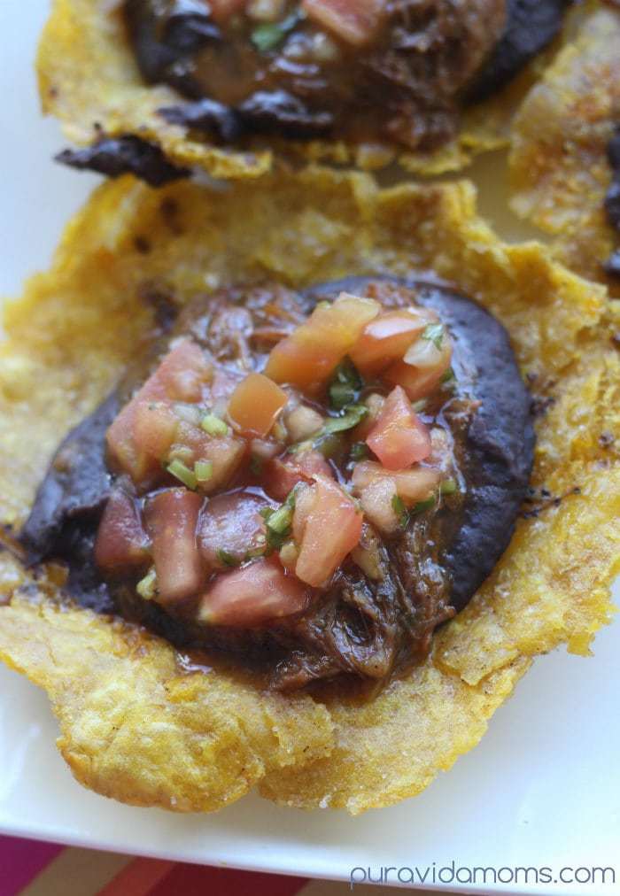 Fried plantains filled with refried beans and pico de gallo.