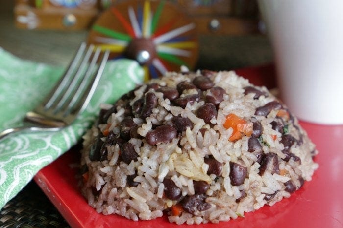 Mound of Costa Rican Gallo Pinto on a red plate.