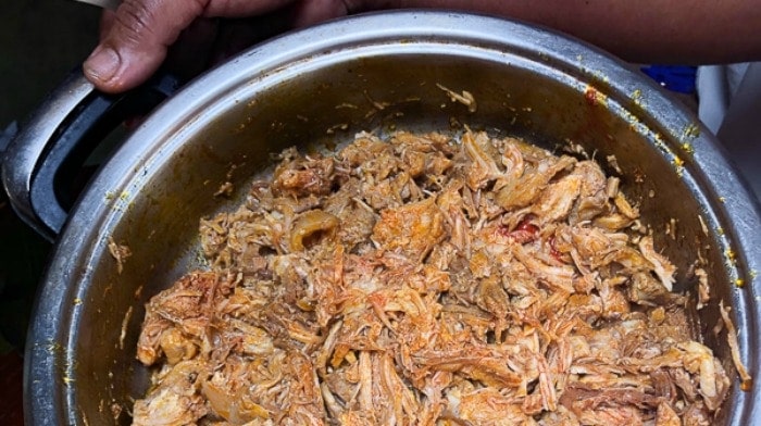 Pot full of freshly cooked Costa Rican Shredded Pork.