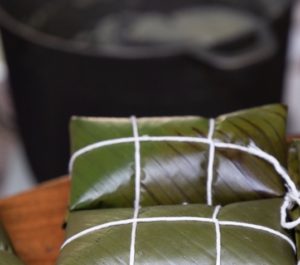 Leaf-wrapped Costa Rican Tamales tied off with twine.