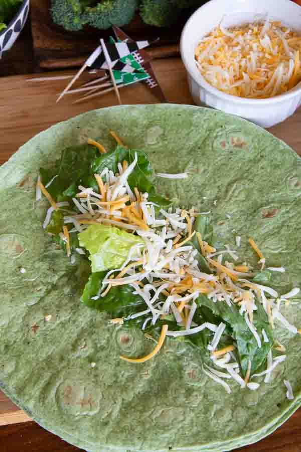 spinach tortilla with lettuce and cheese