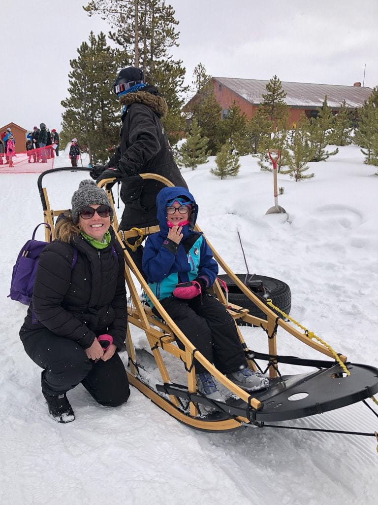 mother and daughter in dog sled at ymca