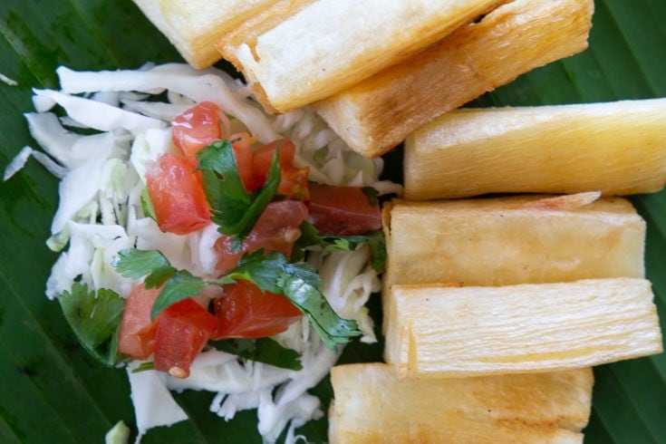 Yuca fries served with cabbage salad and chimichurri sauce.