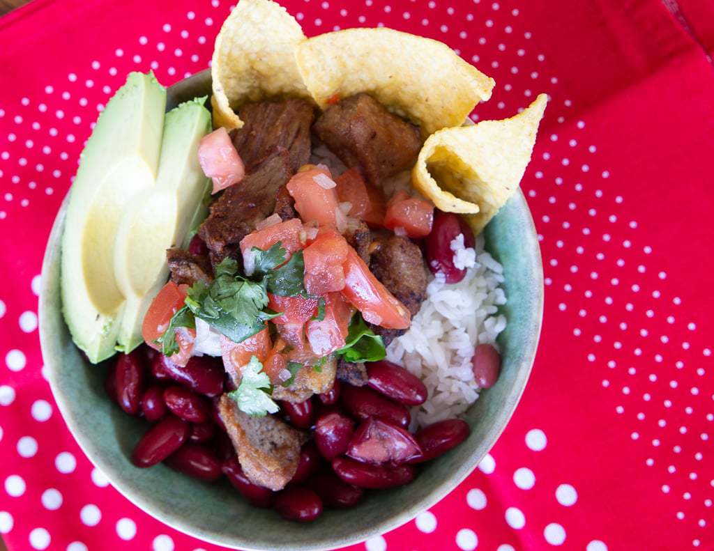 Costa Rican taco bowl chifrijo with chimichurri sauce.