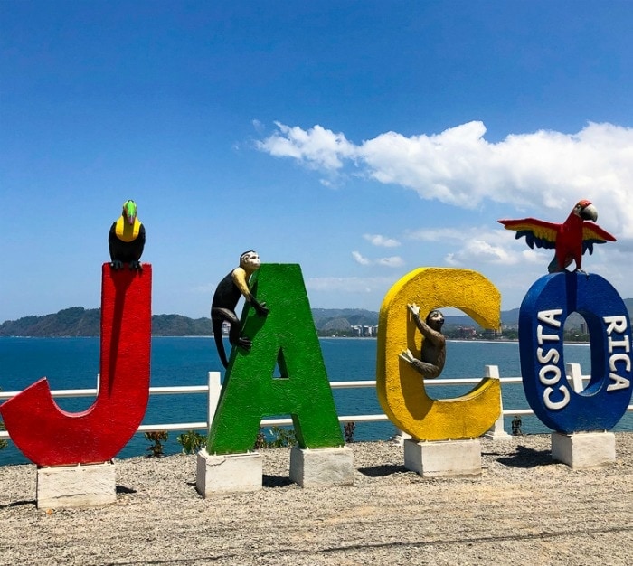Colorful sign in front of Costa Rica's Jaco beach.