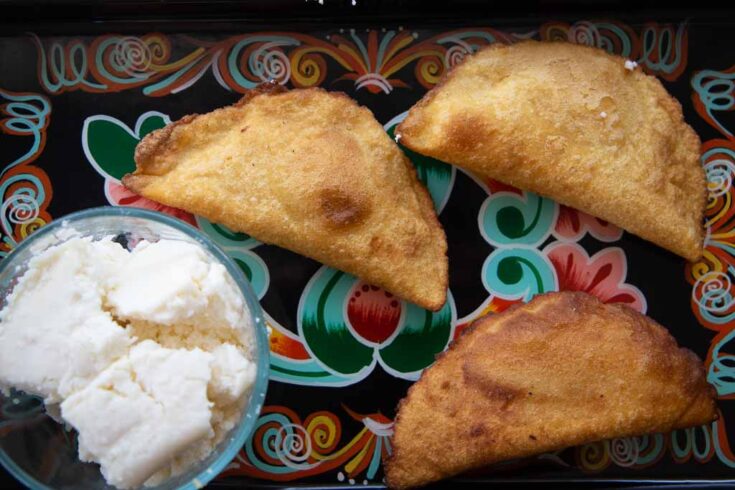 Fully fried cheese empanadas with queso fresco.