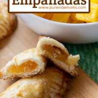 A pineapple empanada cut in half to reveal the inside.