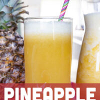 A tall glass of the pineapple Fresca with a straw.