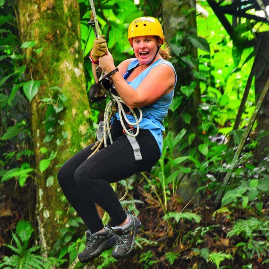 woman ziplining in costa rican rainforest