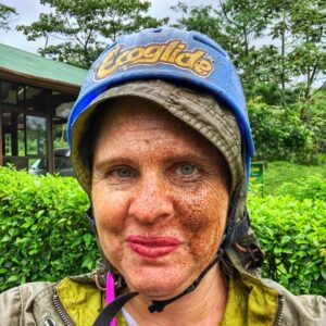 woman's face covered in mud after ziplining in la fortuna costa rica