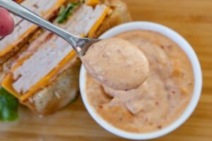 close up on spoon of chipotle aioli sauce.