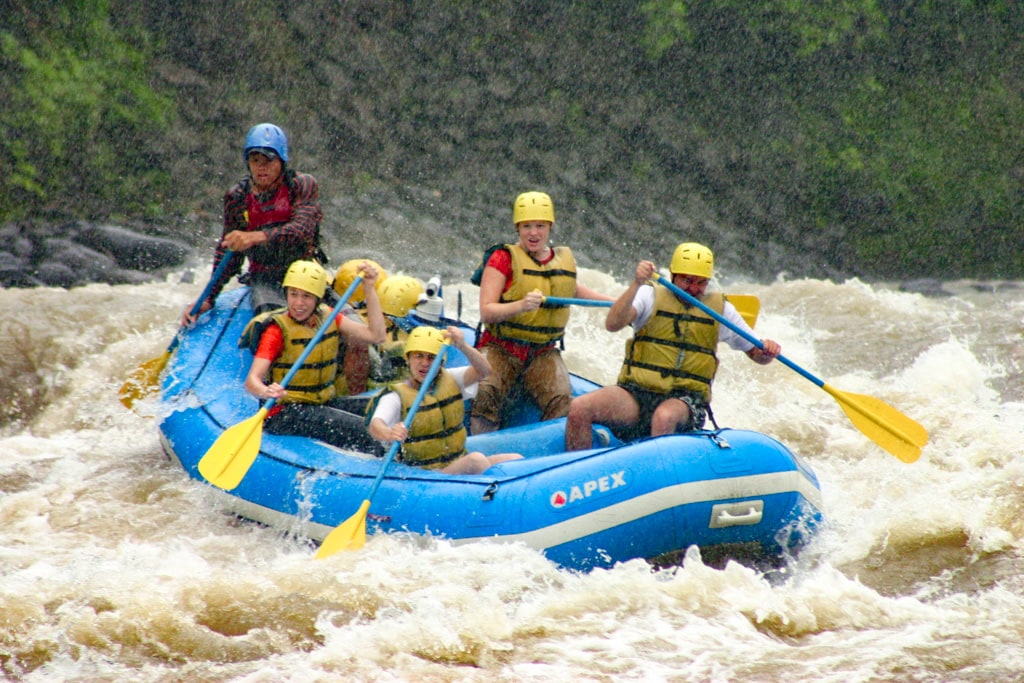 people in a rafting boat