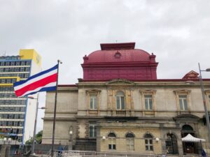 costa rican flag in front of national theater san jose